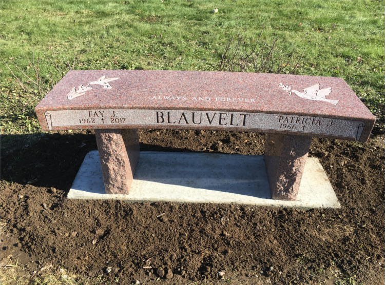 bench in cemetery made of granite